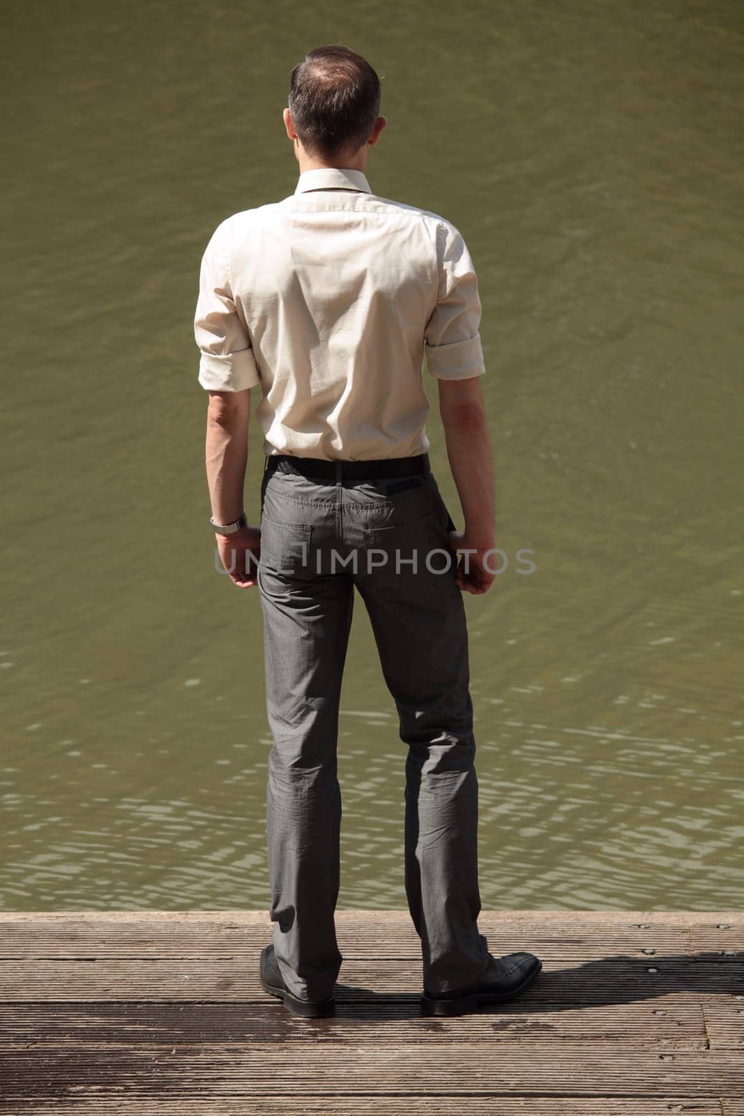 man on the wooden pier