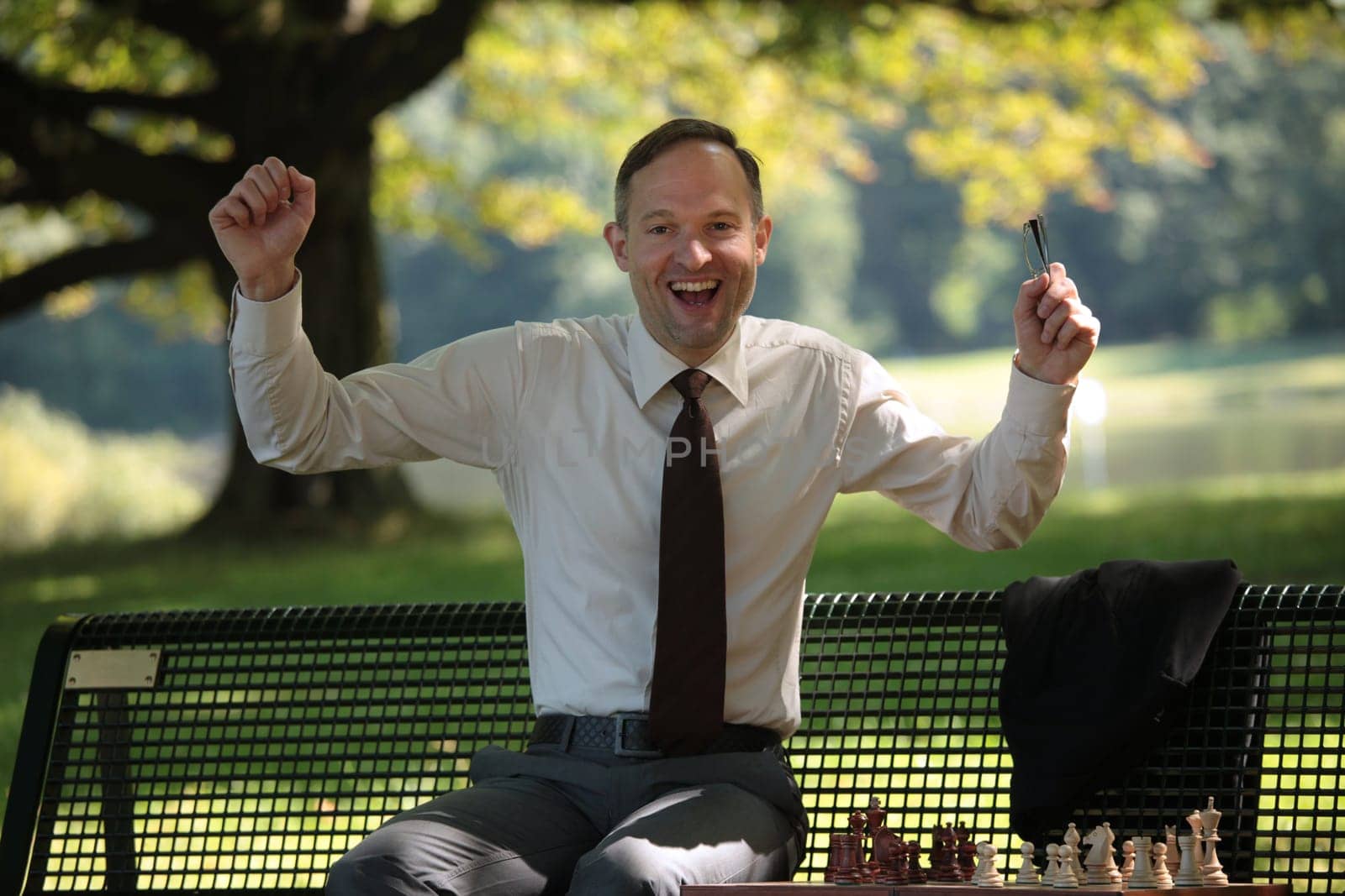 happy businessman playing chess