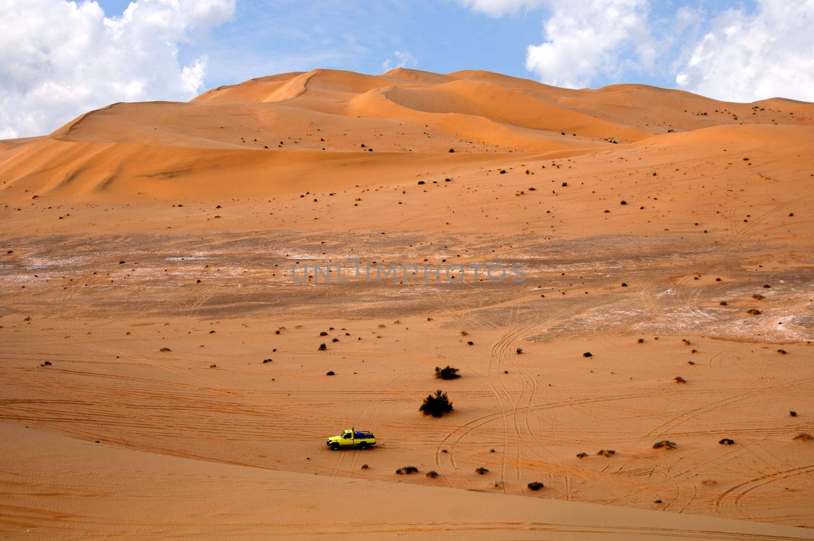 Jeep in the sand dunes of the Sahara,Libya