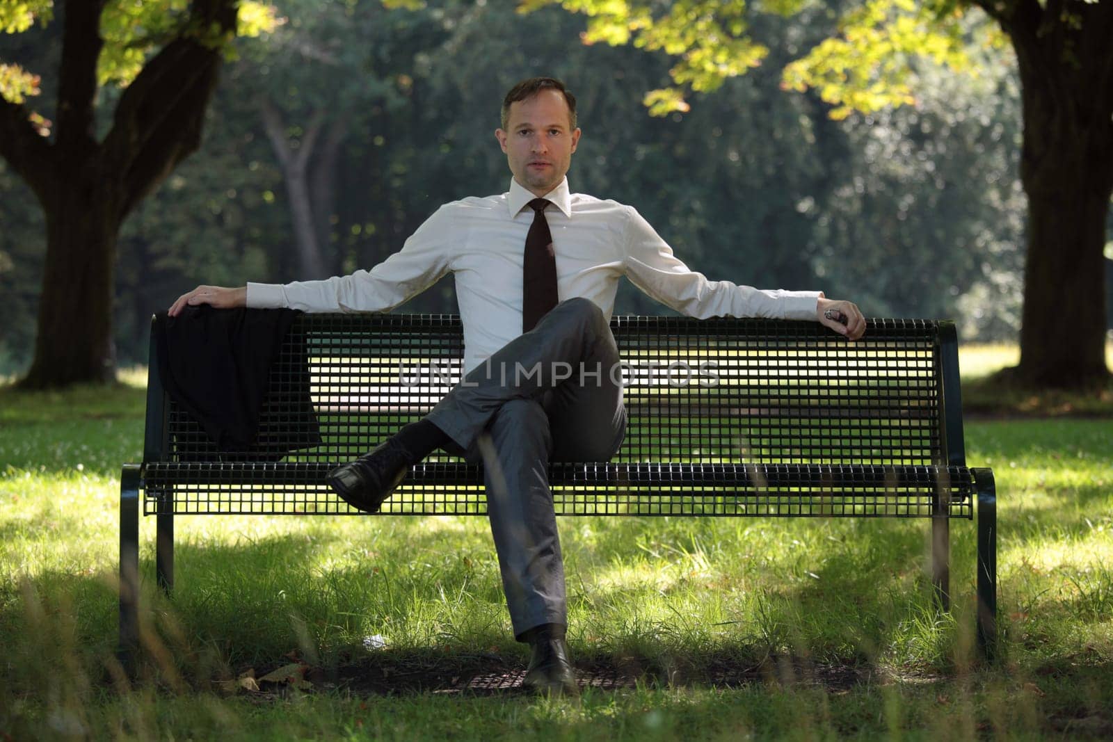 businessman sitting on the beach