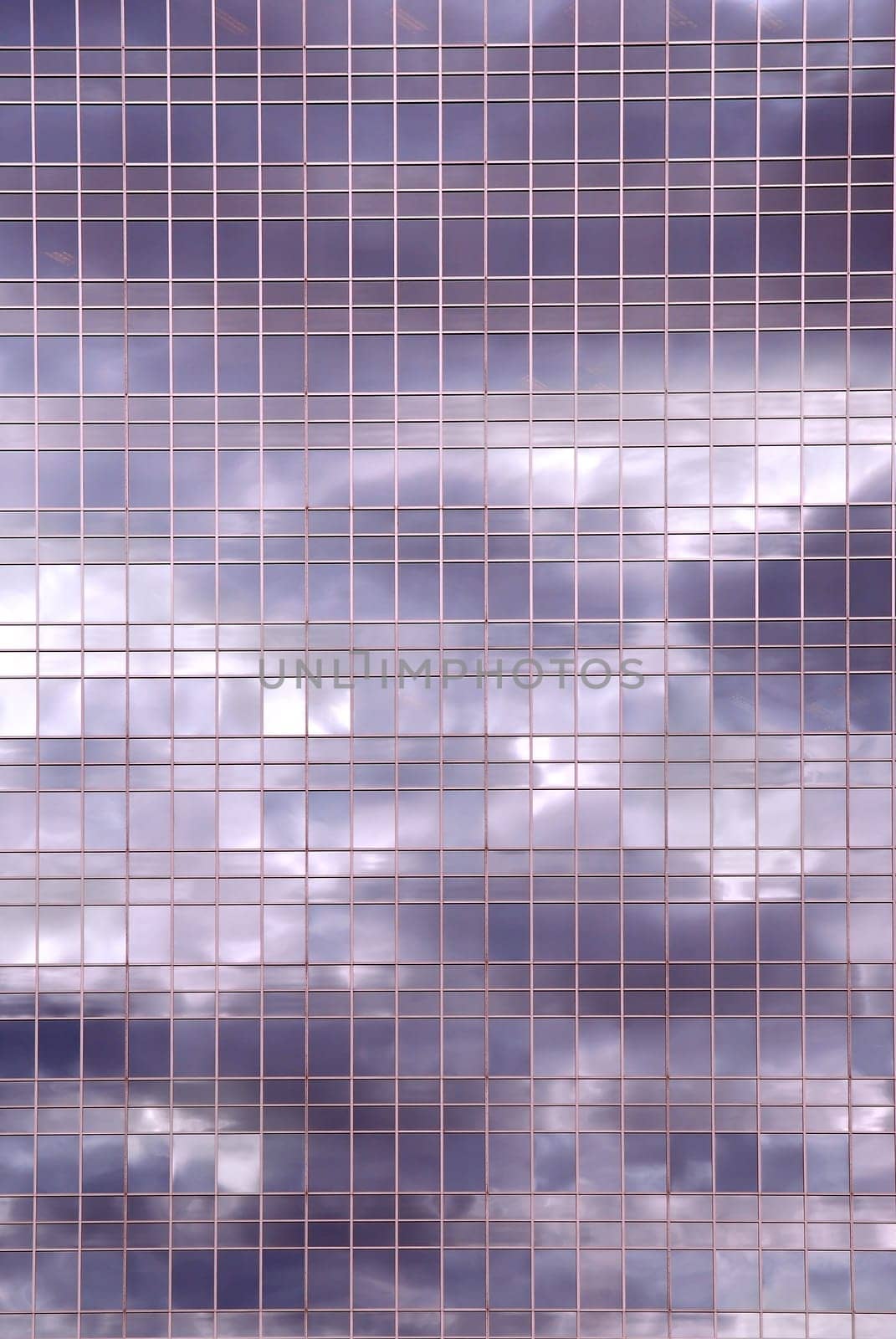 Clouds reflection in office building