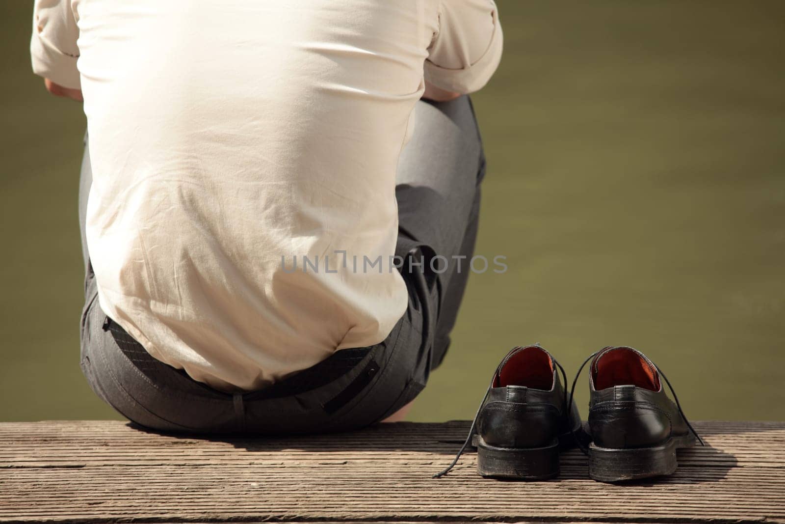 man sitting at the pier
