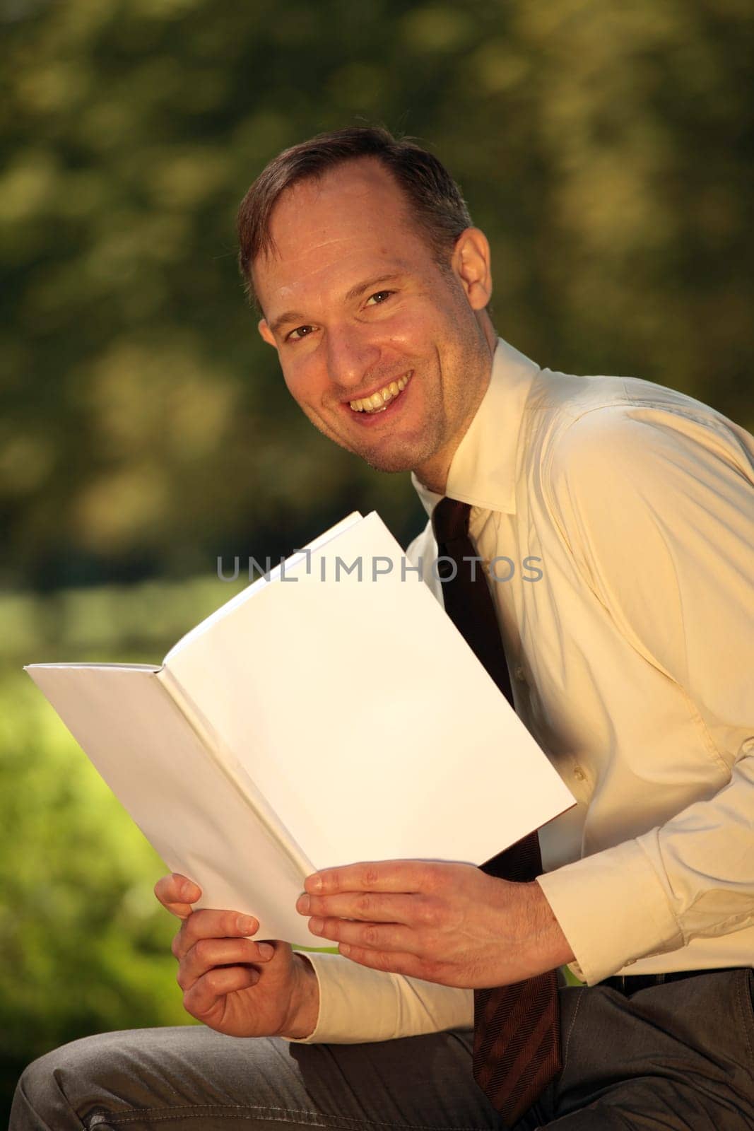 man reading magazine