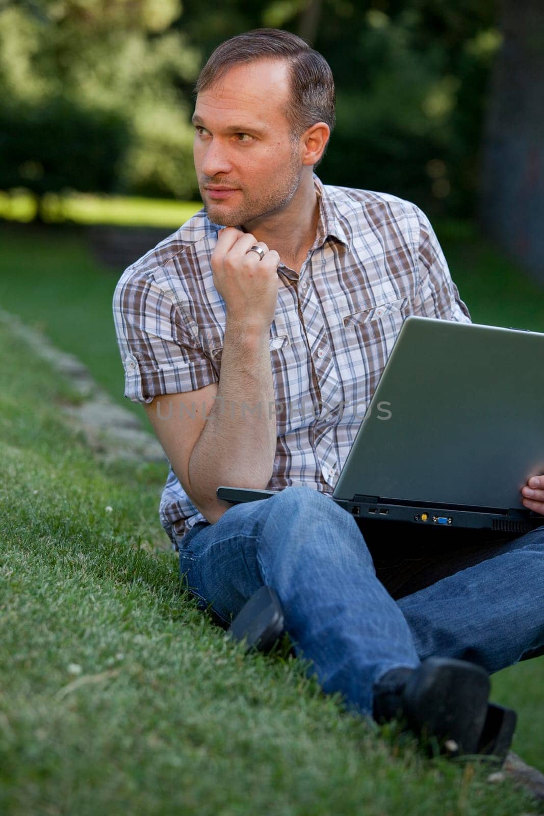 thinking man with laptop