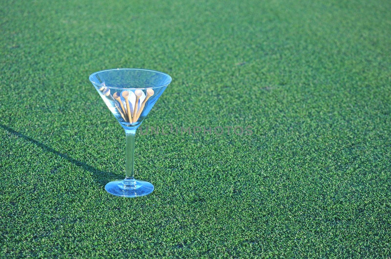 golf martini on grass with copy space