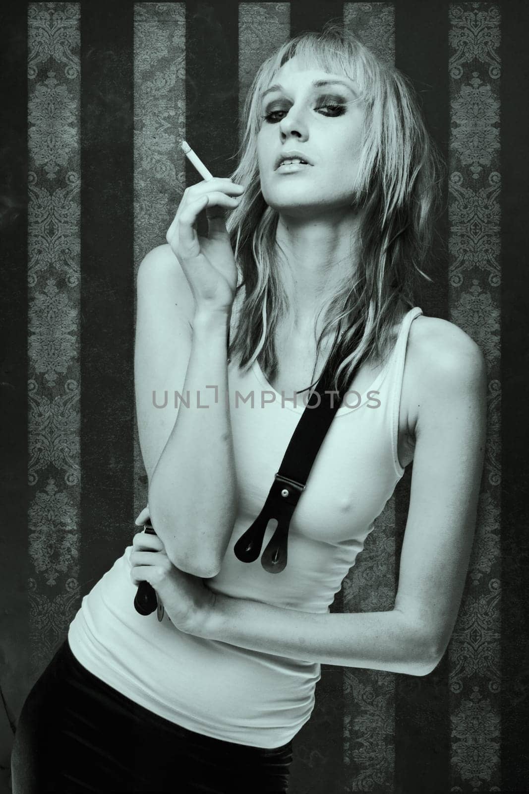 beautiful smoking woman over abstract vintage wallpaper