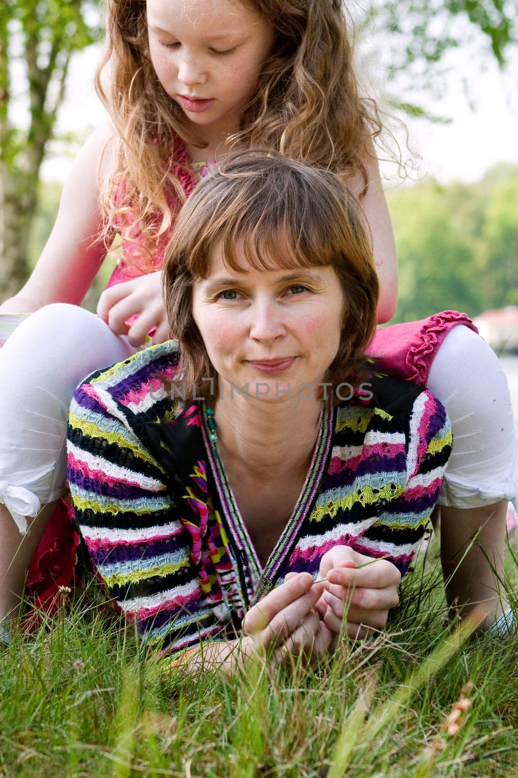 Daugther sitting on mom