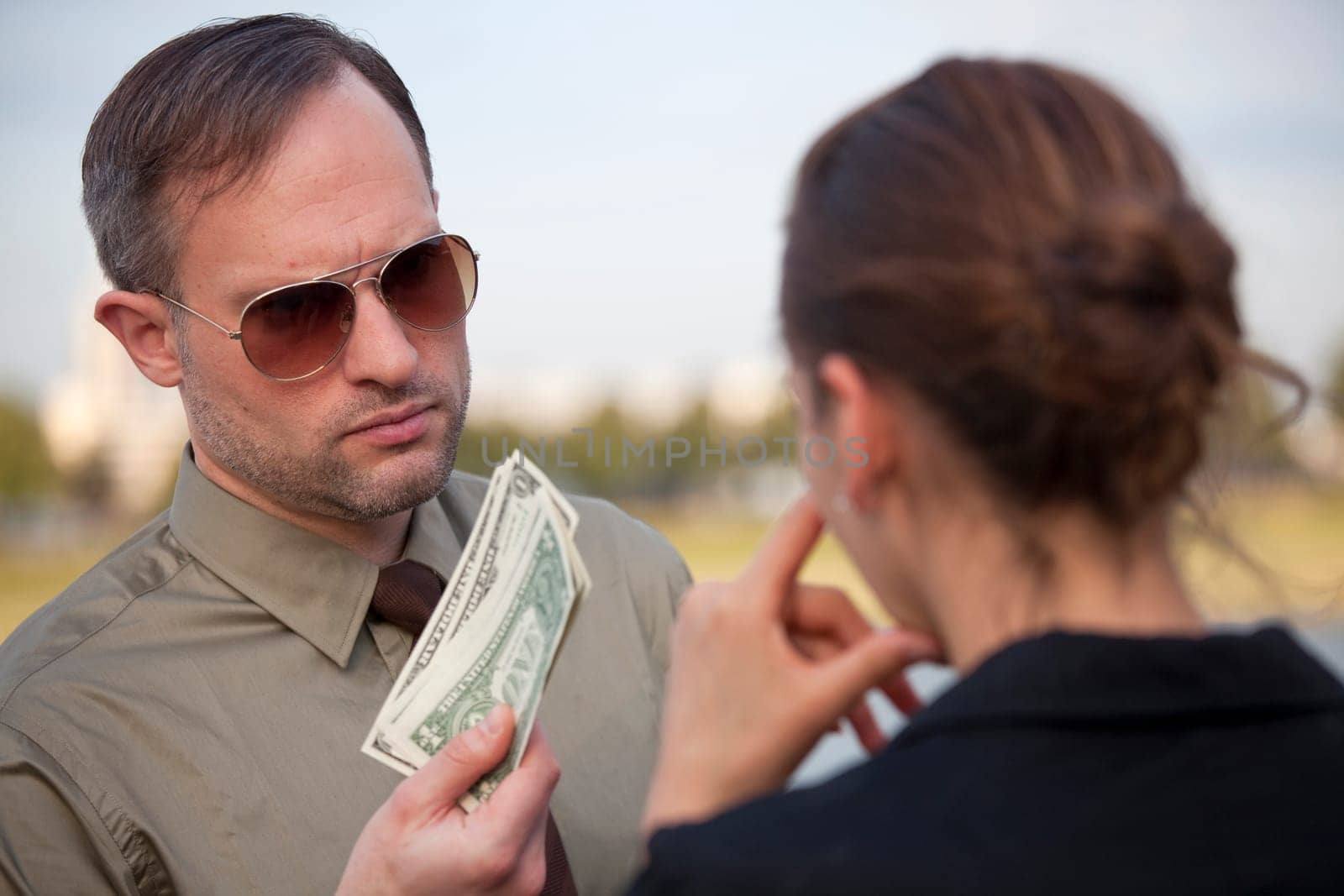 Man offers money to a woman