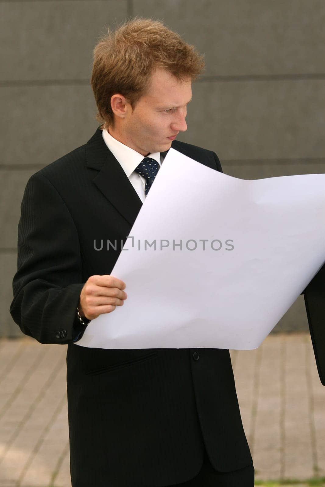 Man reads blueprints
