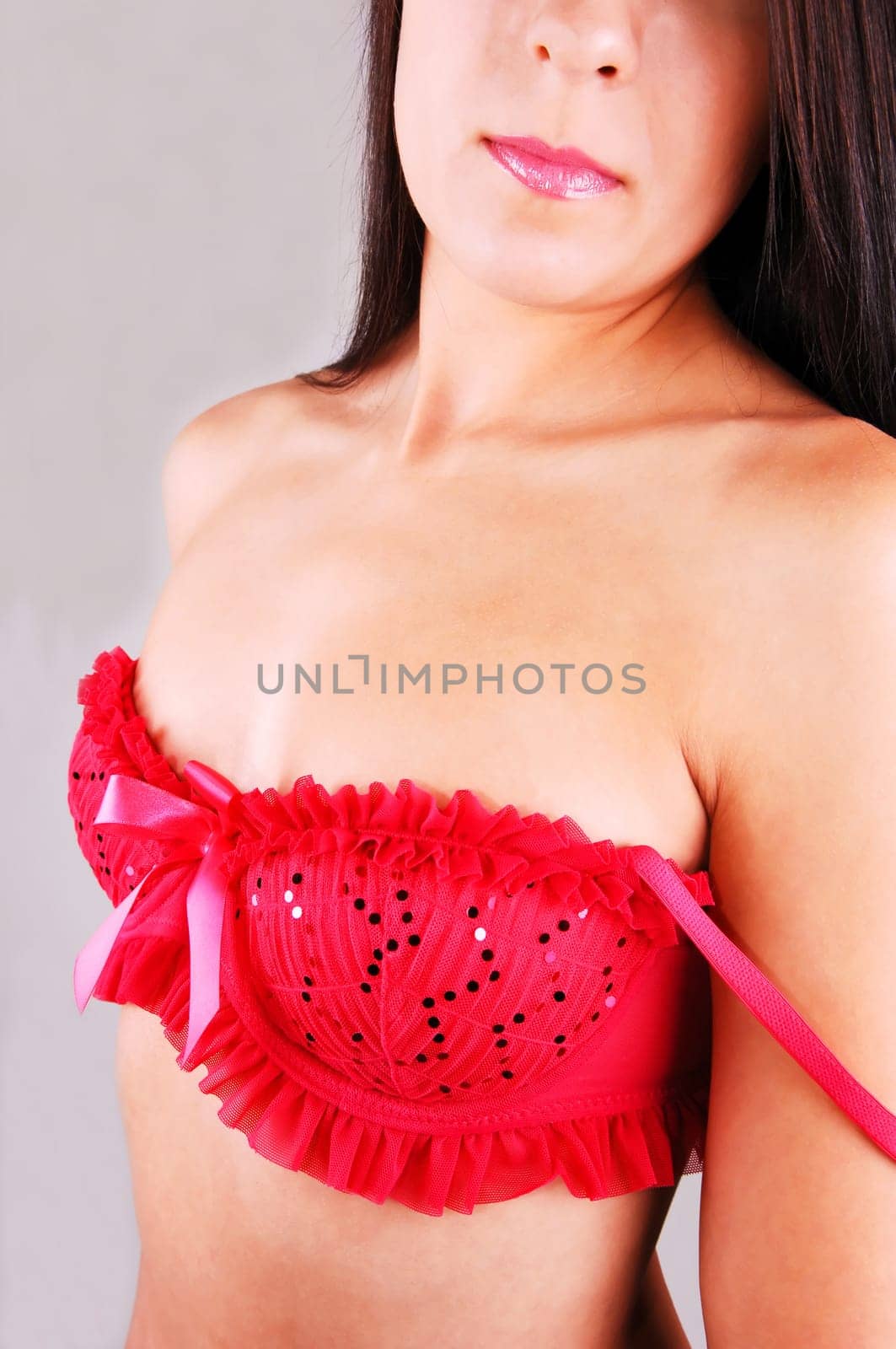 Young woman in red bra.