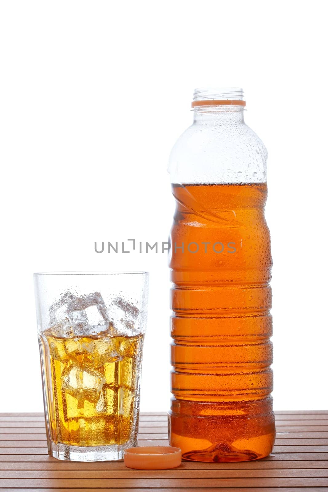 Glass and bottle of ice tea