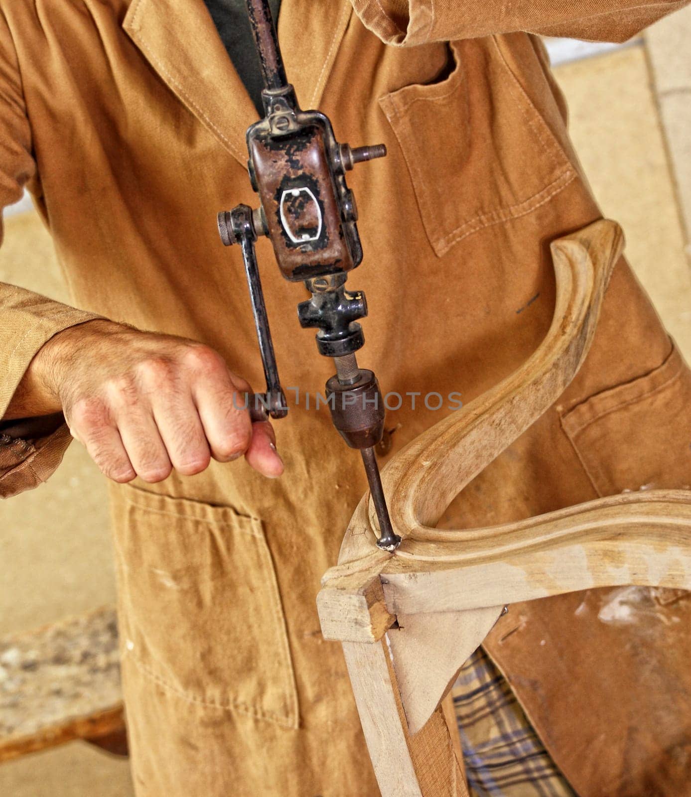 carpenter with hand drill