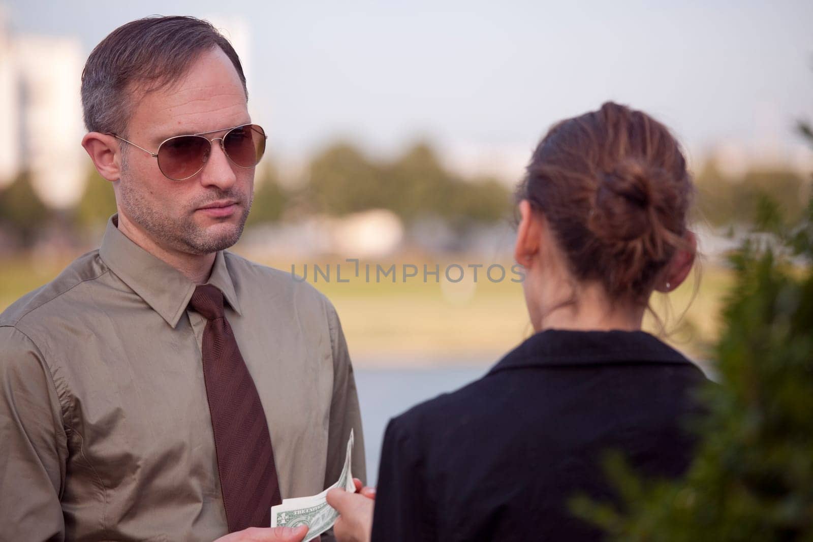man gives money woman