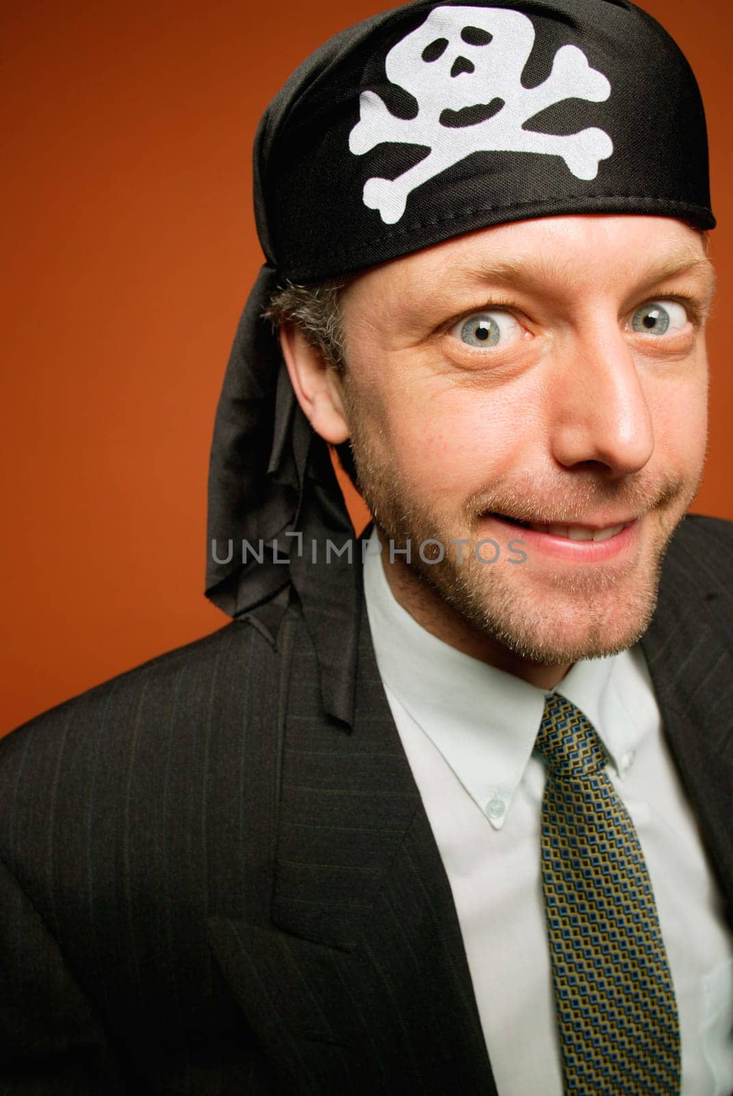 Man having fun playing a practical joke as a wacky pirate