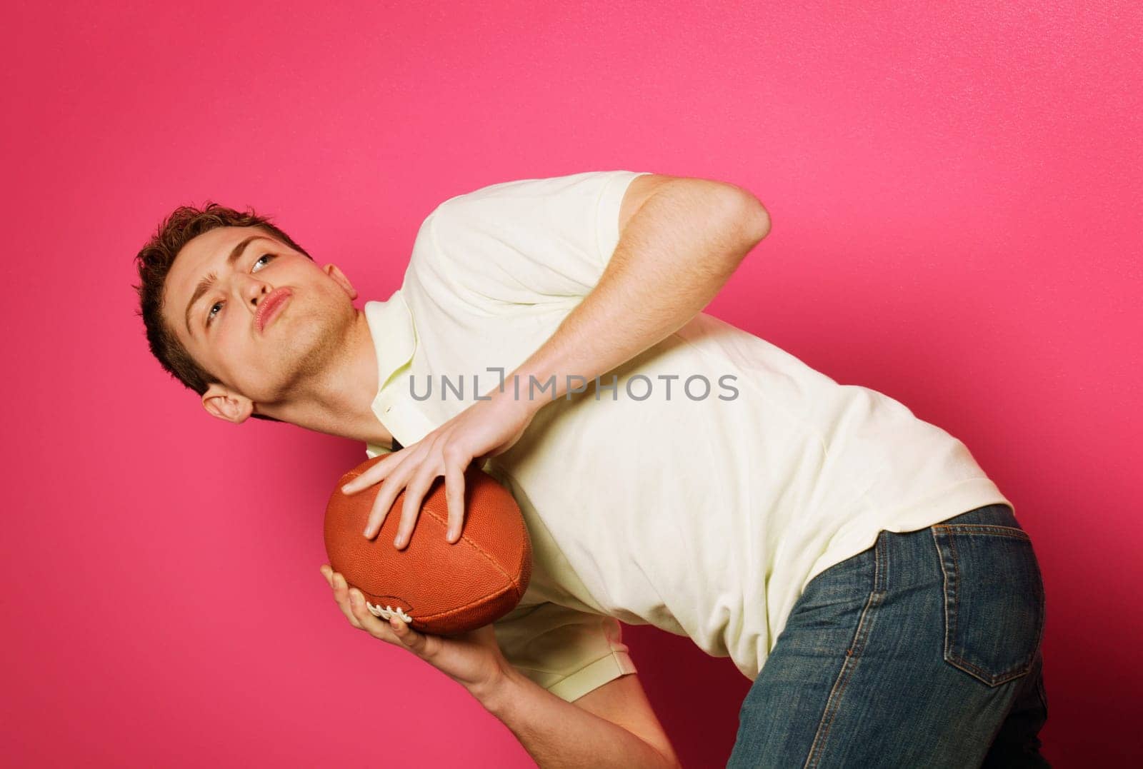 Teen holding football