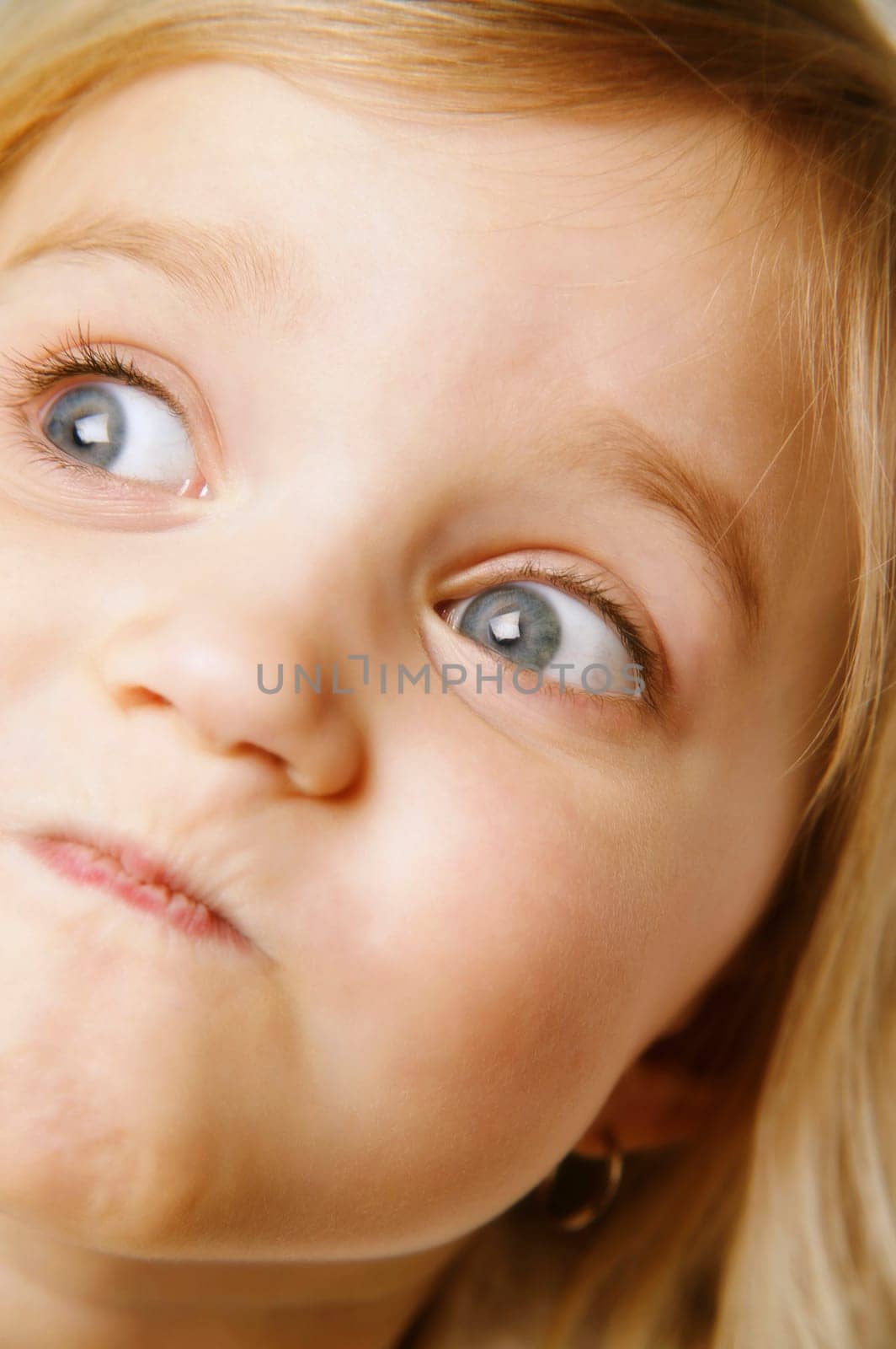 Little girl making a face