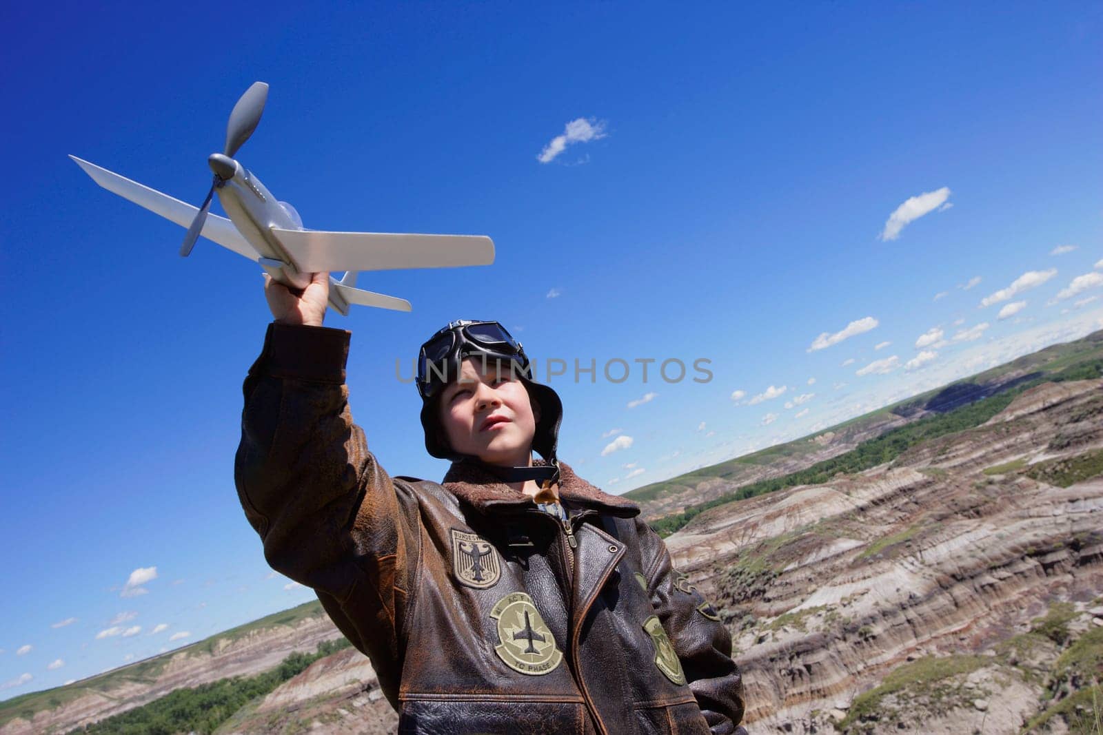 Young child playing with airplane