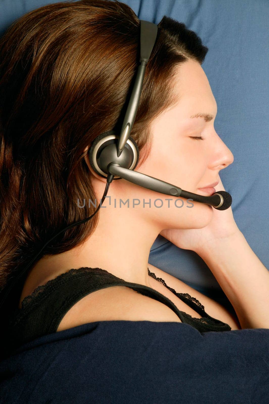 Profile of woman sleeping with headset