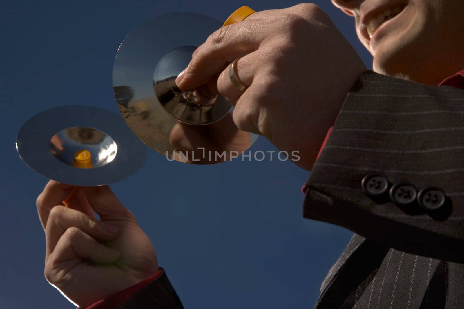 Businessman with cymbal