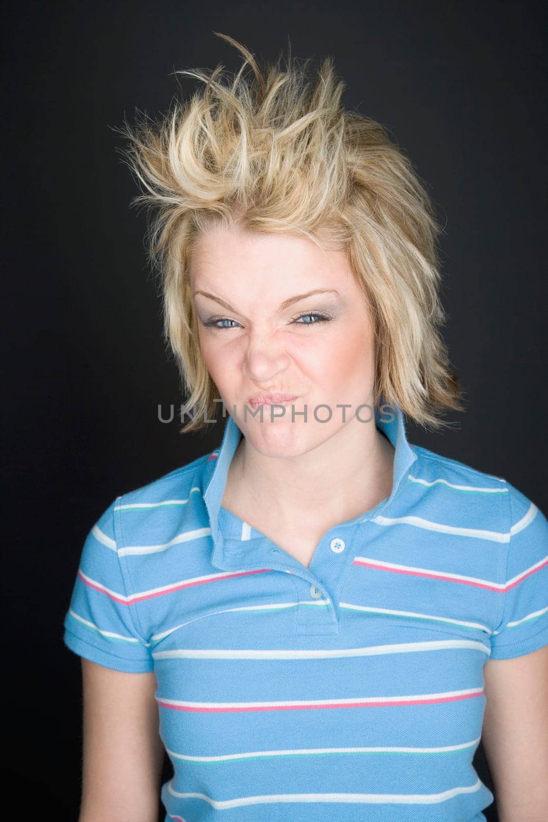 Young blonde woman making a funny face