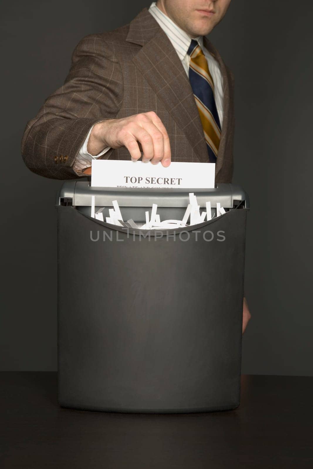 Businessman shredding document