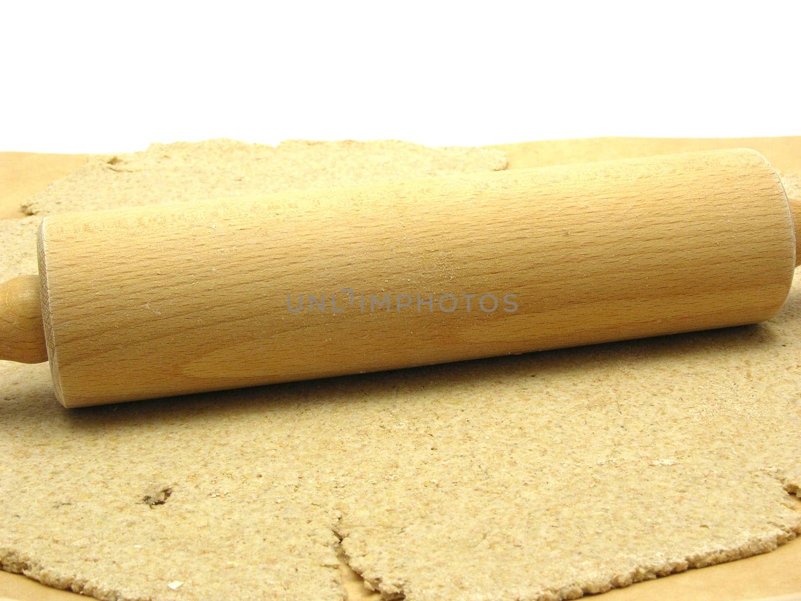Wholemeal dough rolled out with a rolling pin