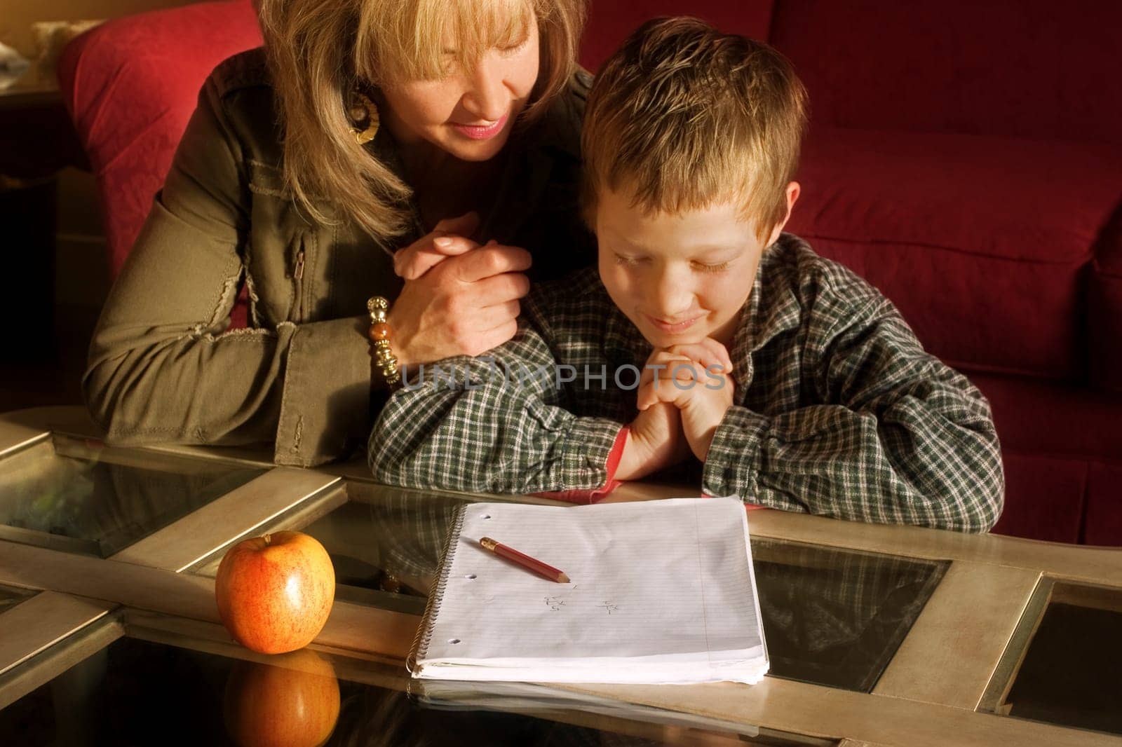 Mother and son praying together