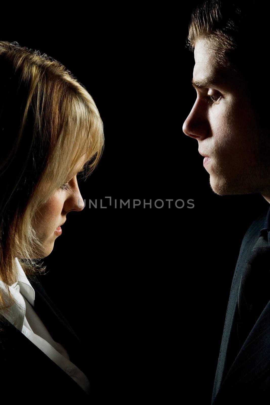 Side profile of a couple looking serious