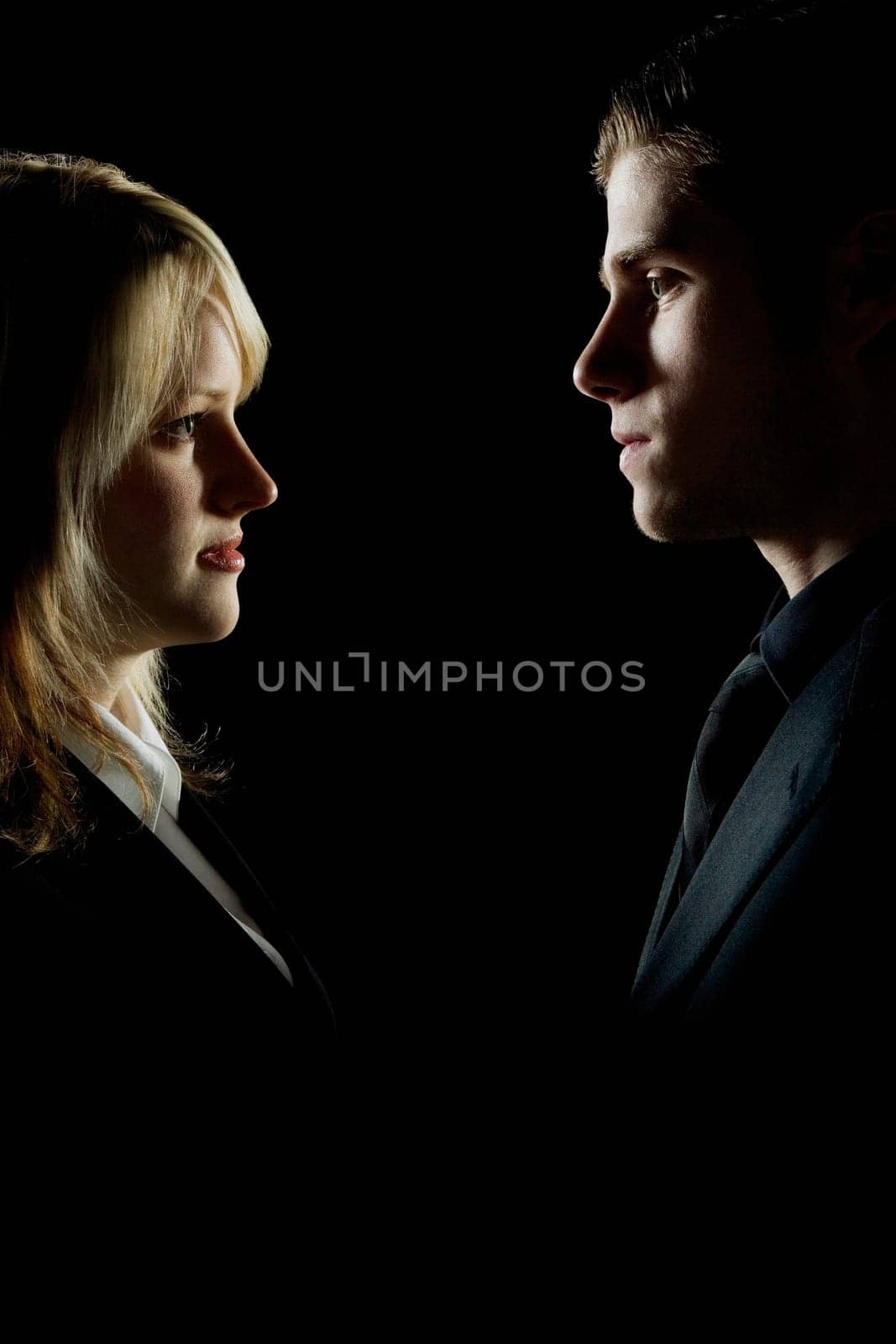 Side profile of a couple looking at each other