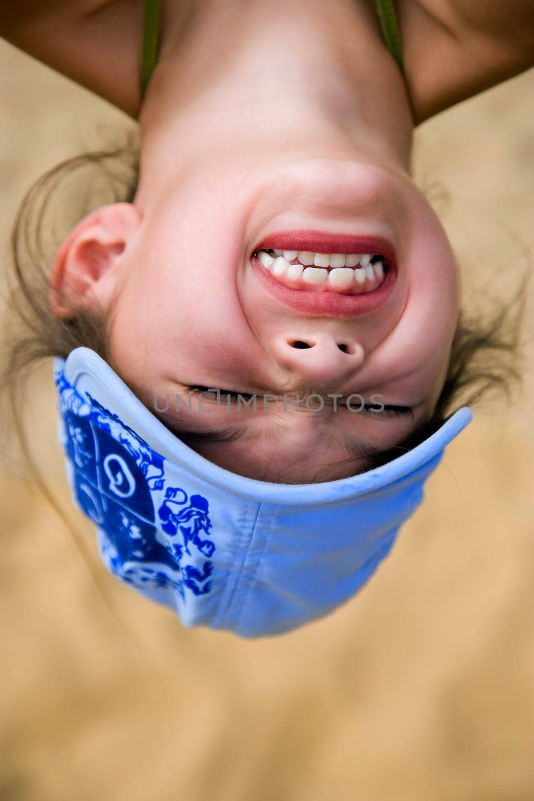 Girl hanging upside down
