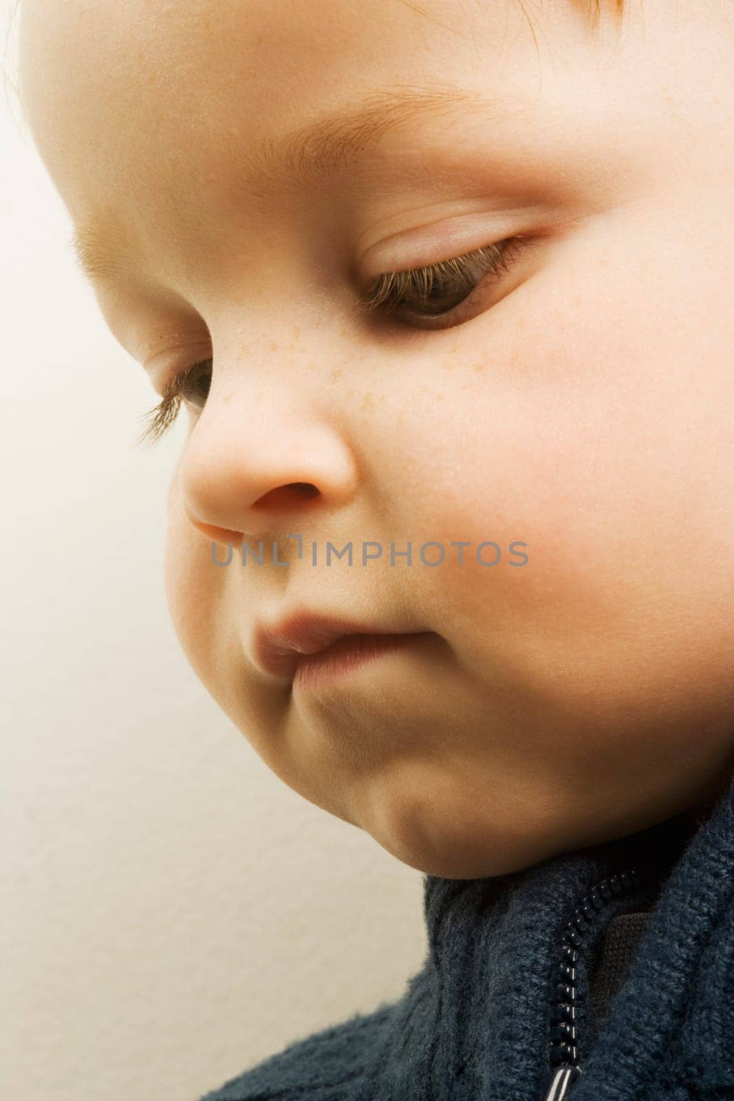 Young boy looking down