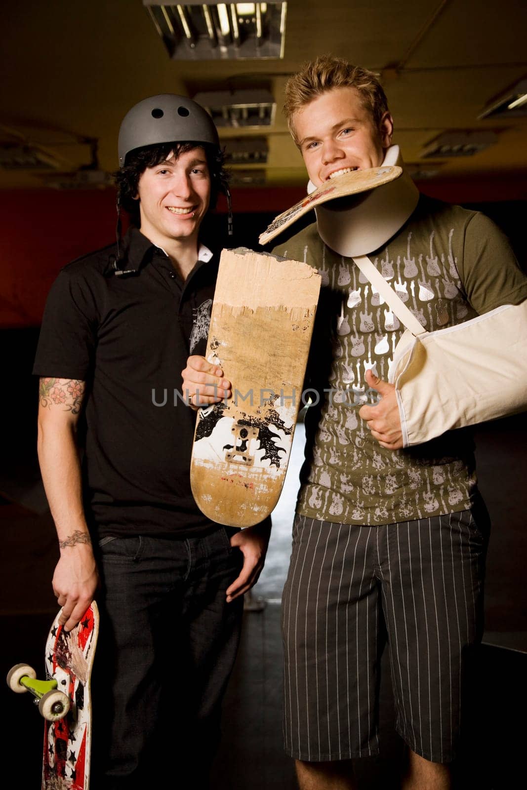 Two skateboarders together