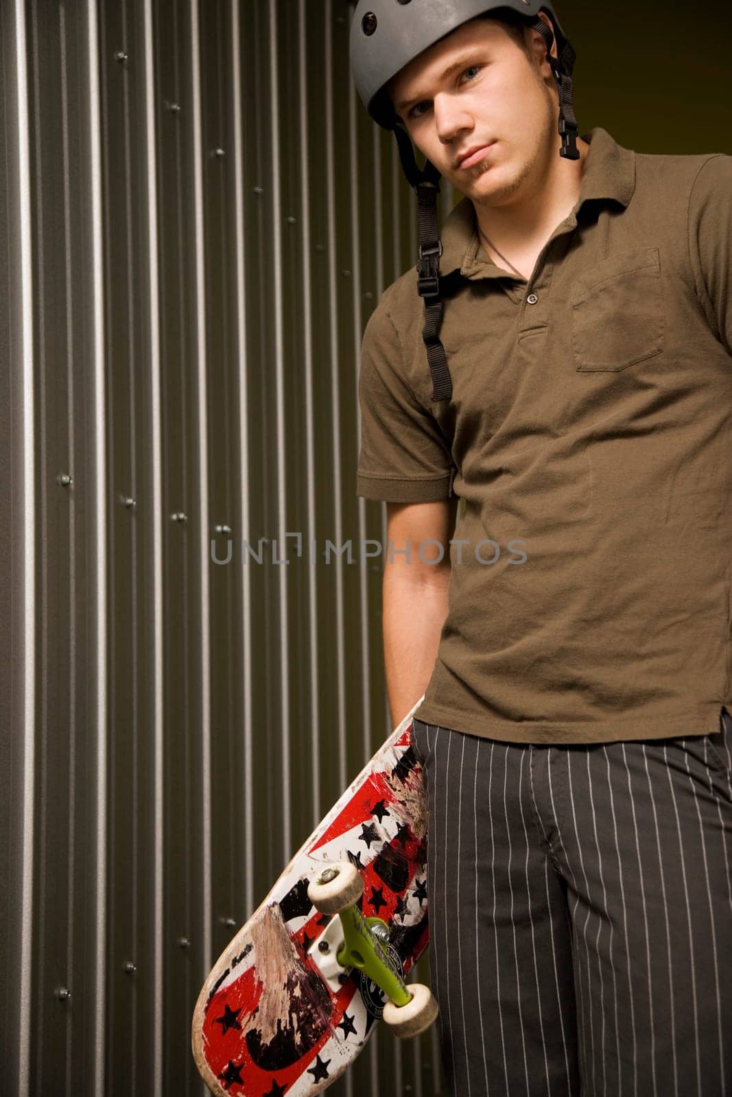 Guy holding a skateboard