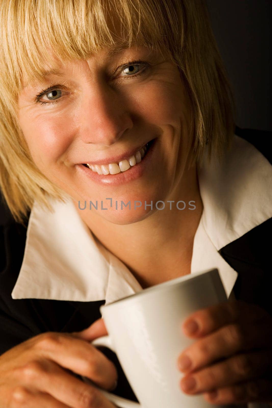 A woman holding a mug