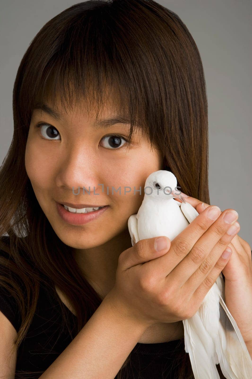 A woman holding a dove