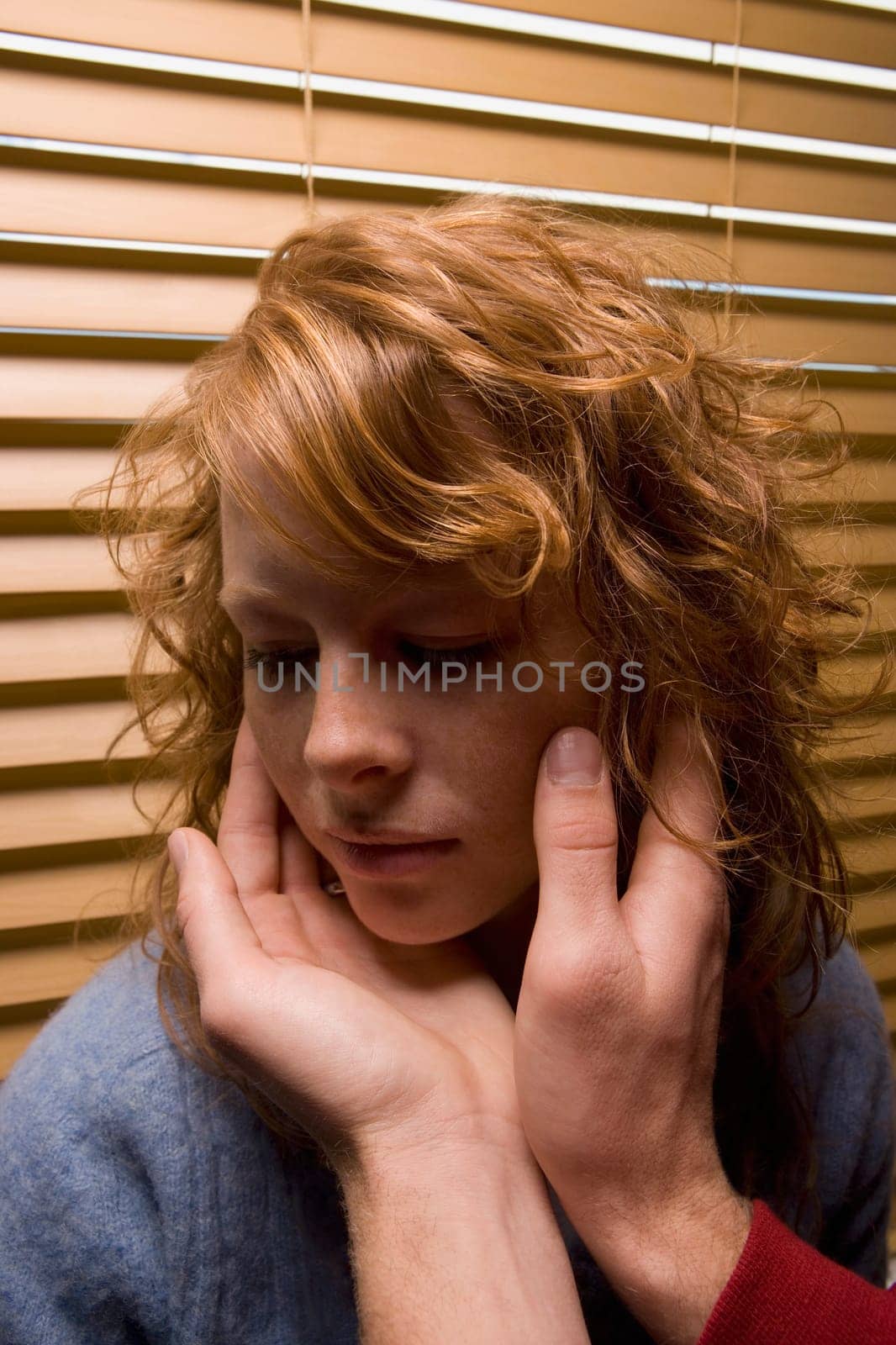 Man's hands touching a woman's face