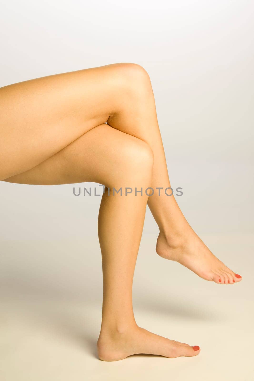 Young woman's legs crossed