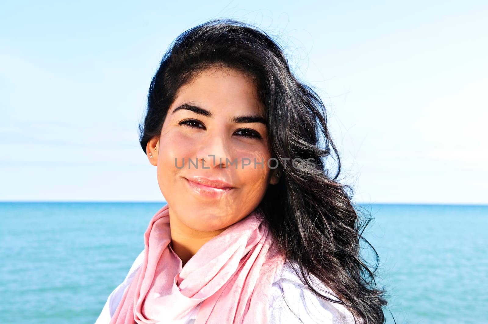 Beautiful young woman at beach