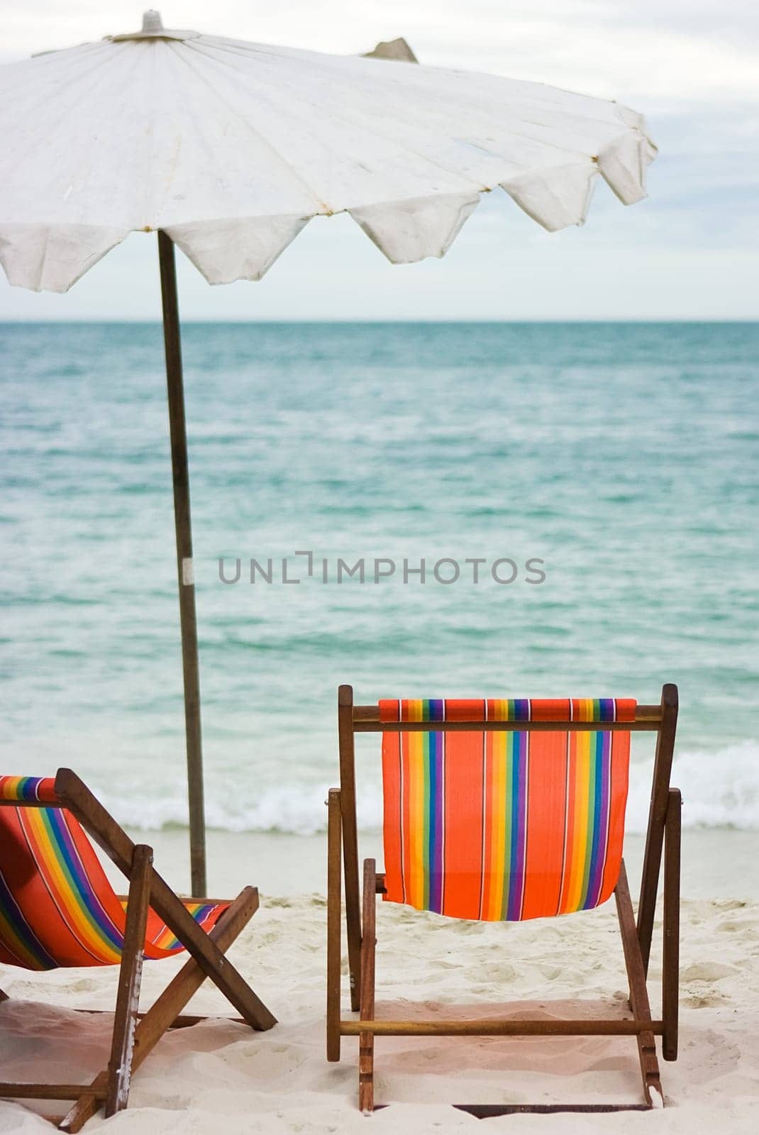 Two chairs and umbrella on the beach
