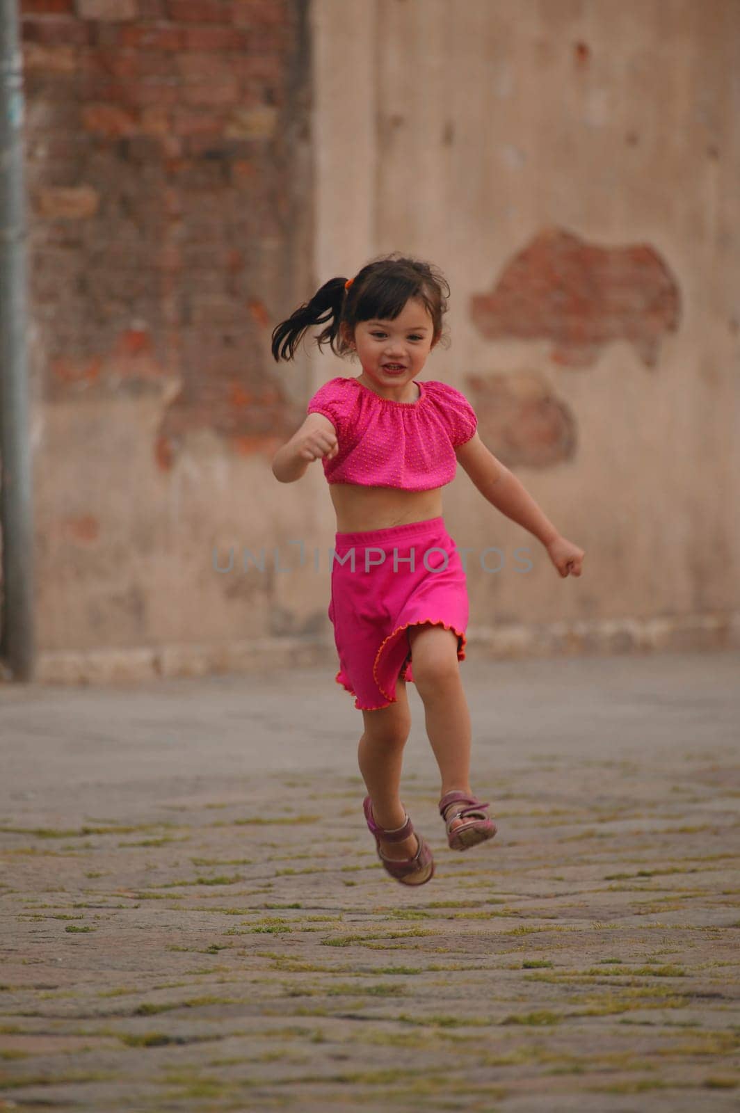 Girl running through street
