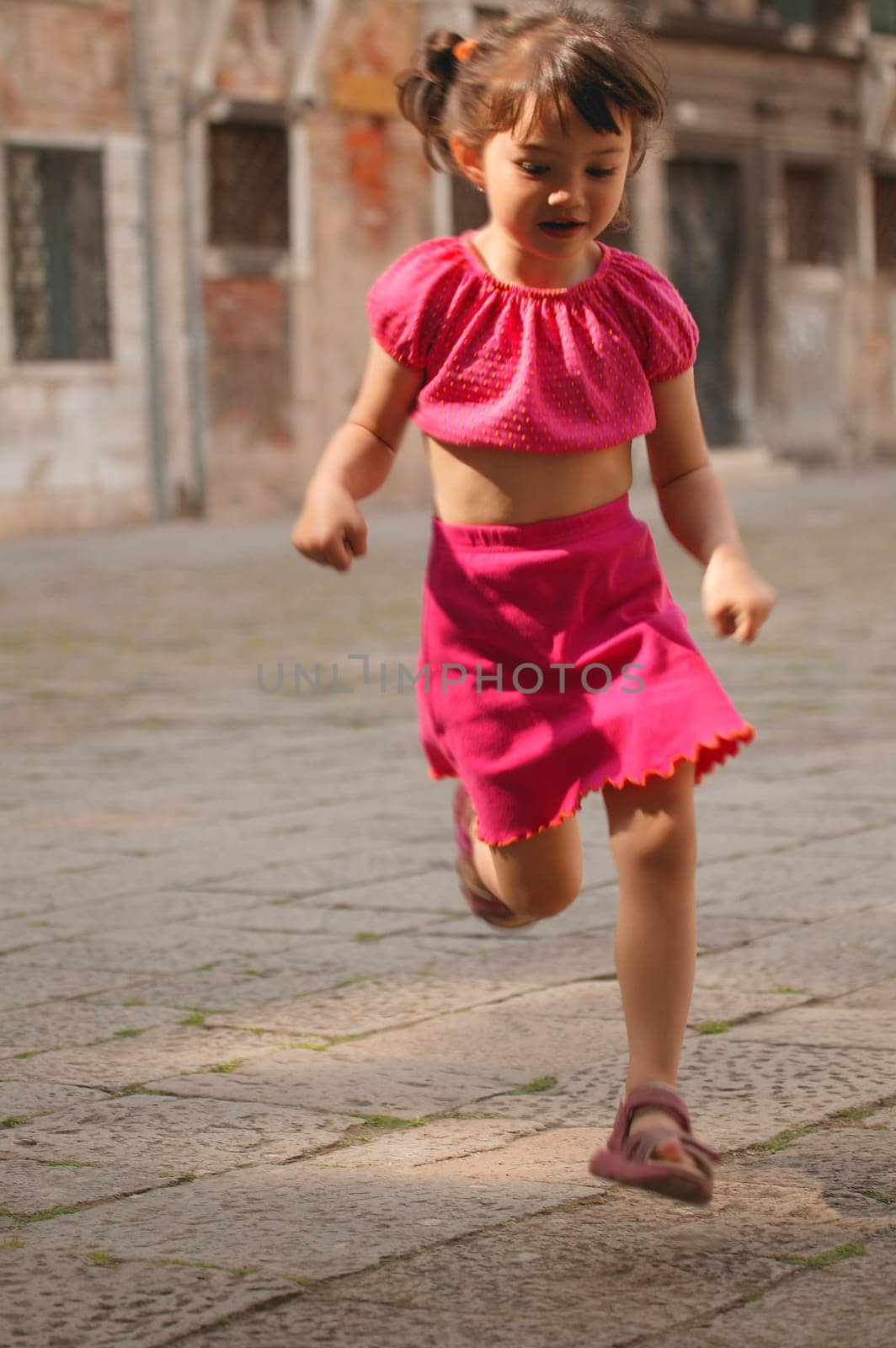 Girl running through street