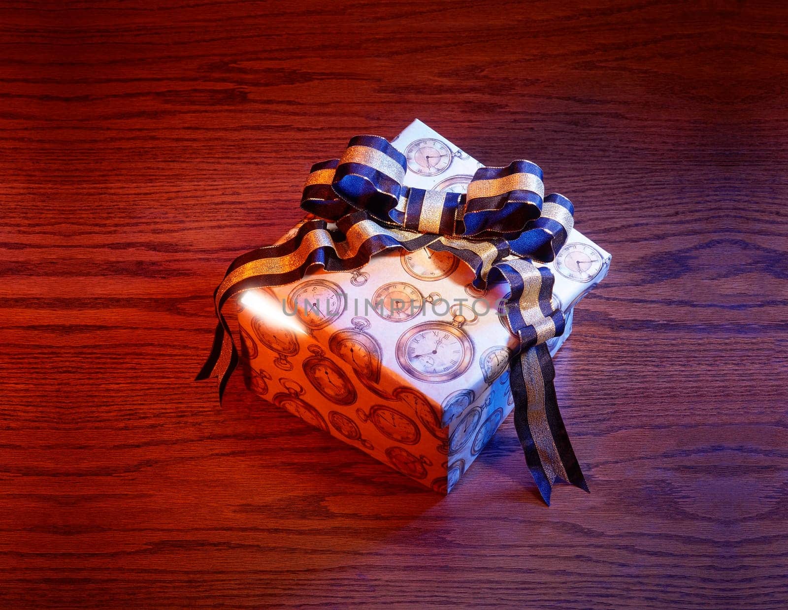Present with blue and gold bow