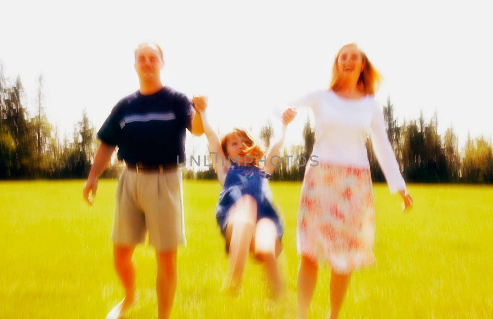 Parents play with child