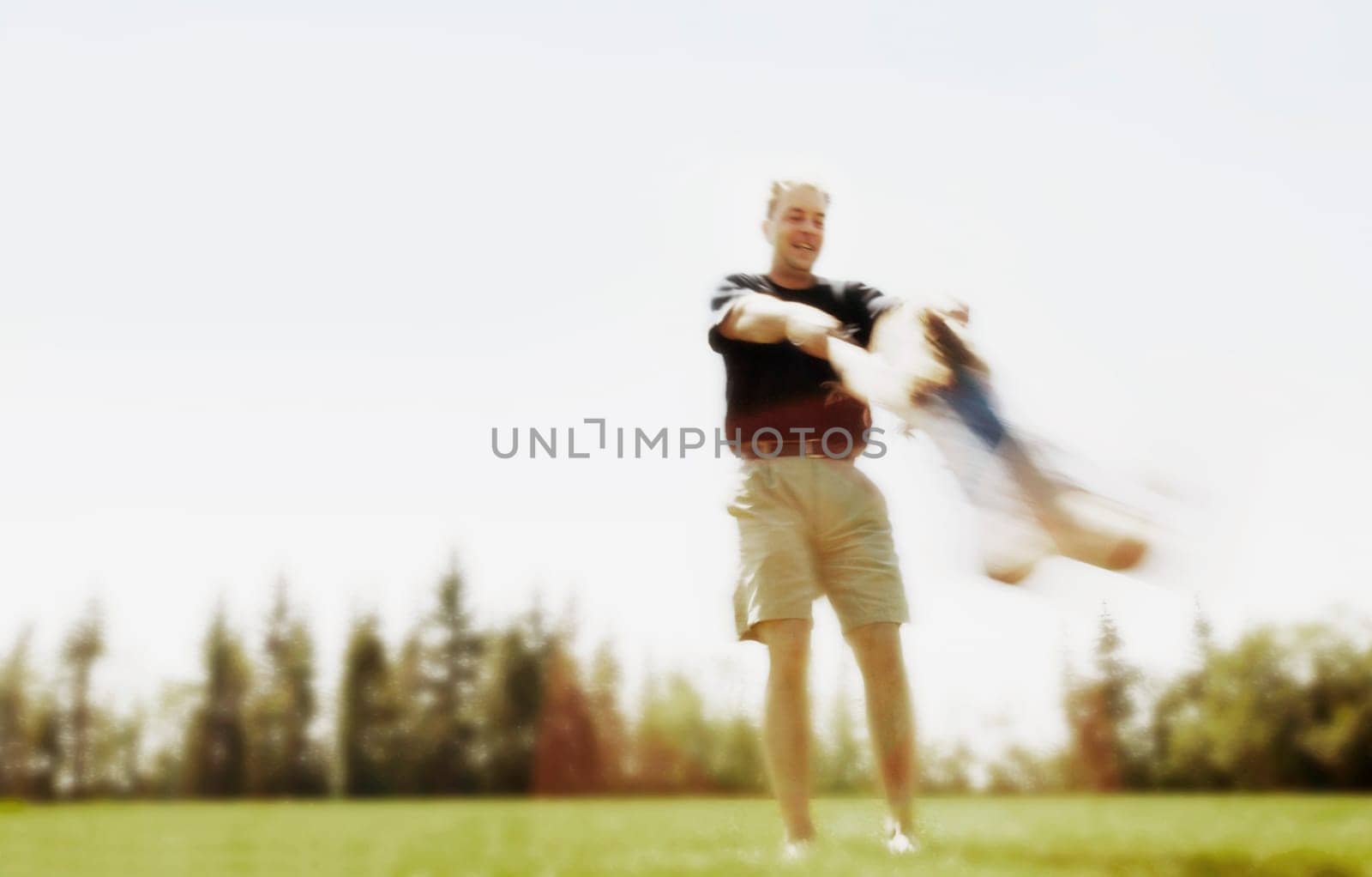 Father swings child around