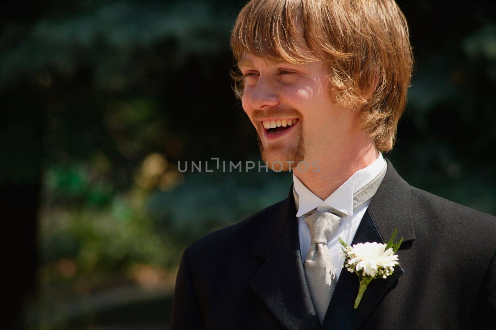 Groom smiles