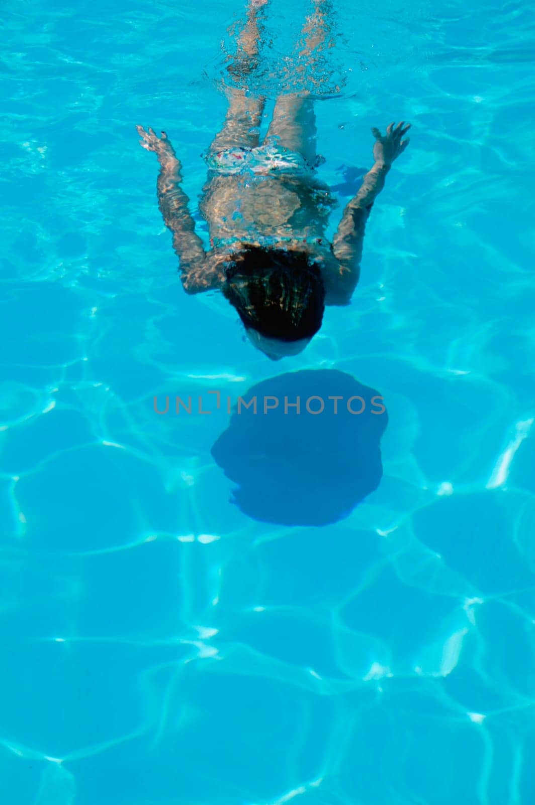 Woman swims underwater