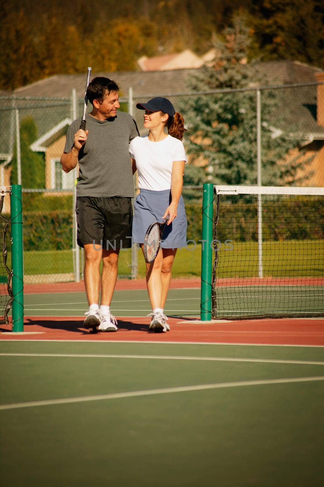 Couple in tennis courts
