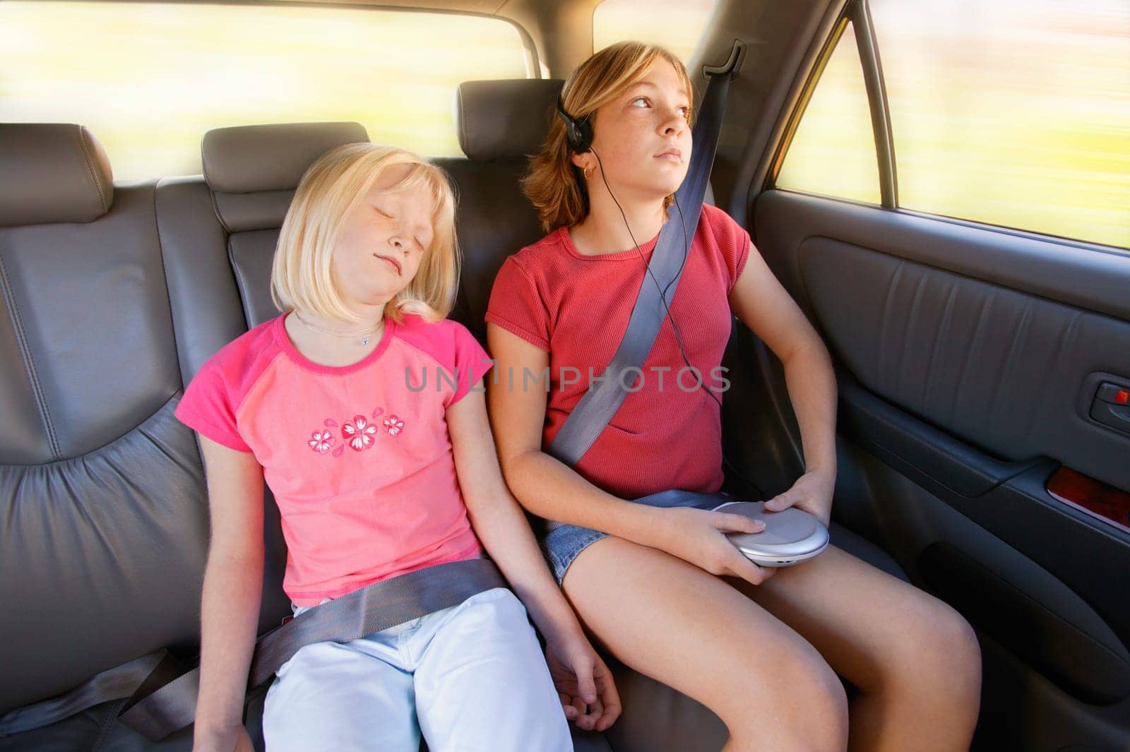 Girls in the back seat of a car