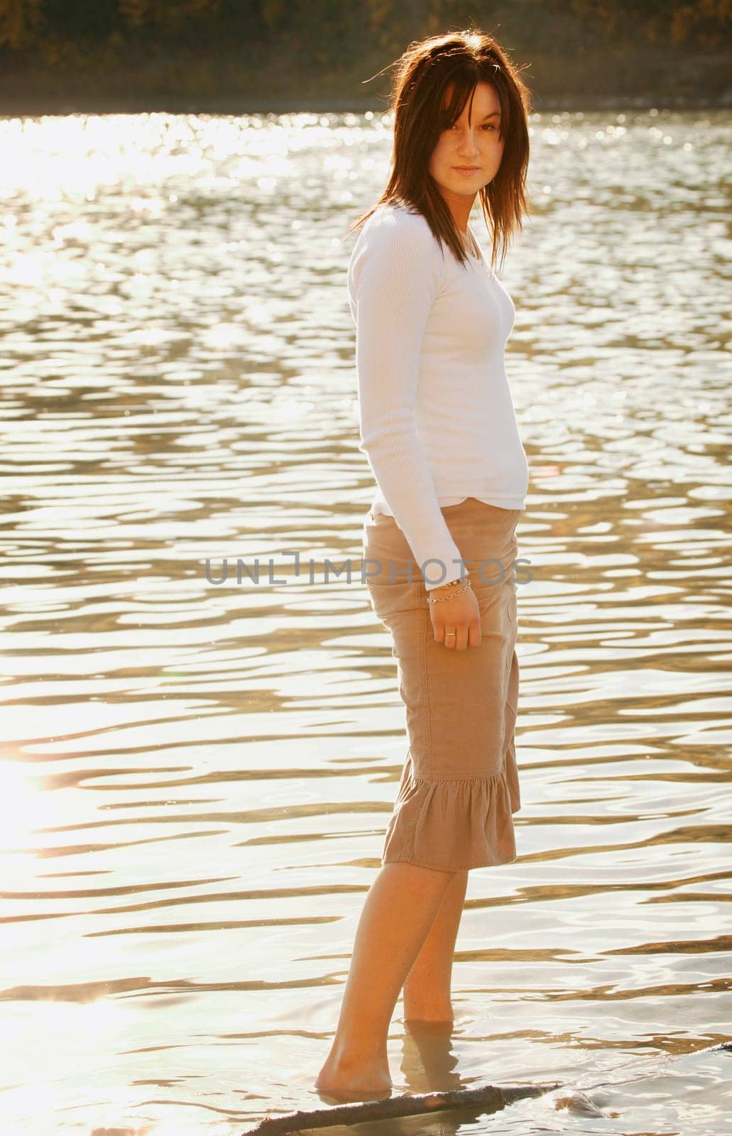 A woman wades in the water