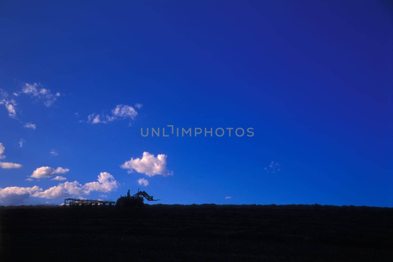 A tractor on the horizon